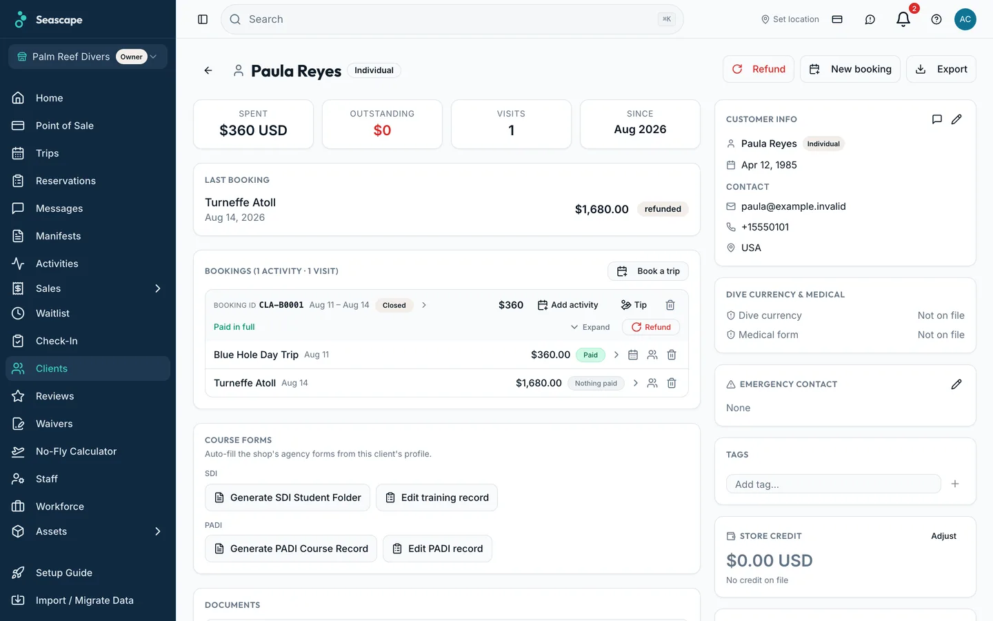 A client record: certification, dive history, and every booking and payment on one page.