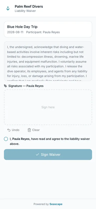 The liability waiver on a phone: the diver reads, signs with a finger, and it is filed against their booking.